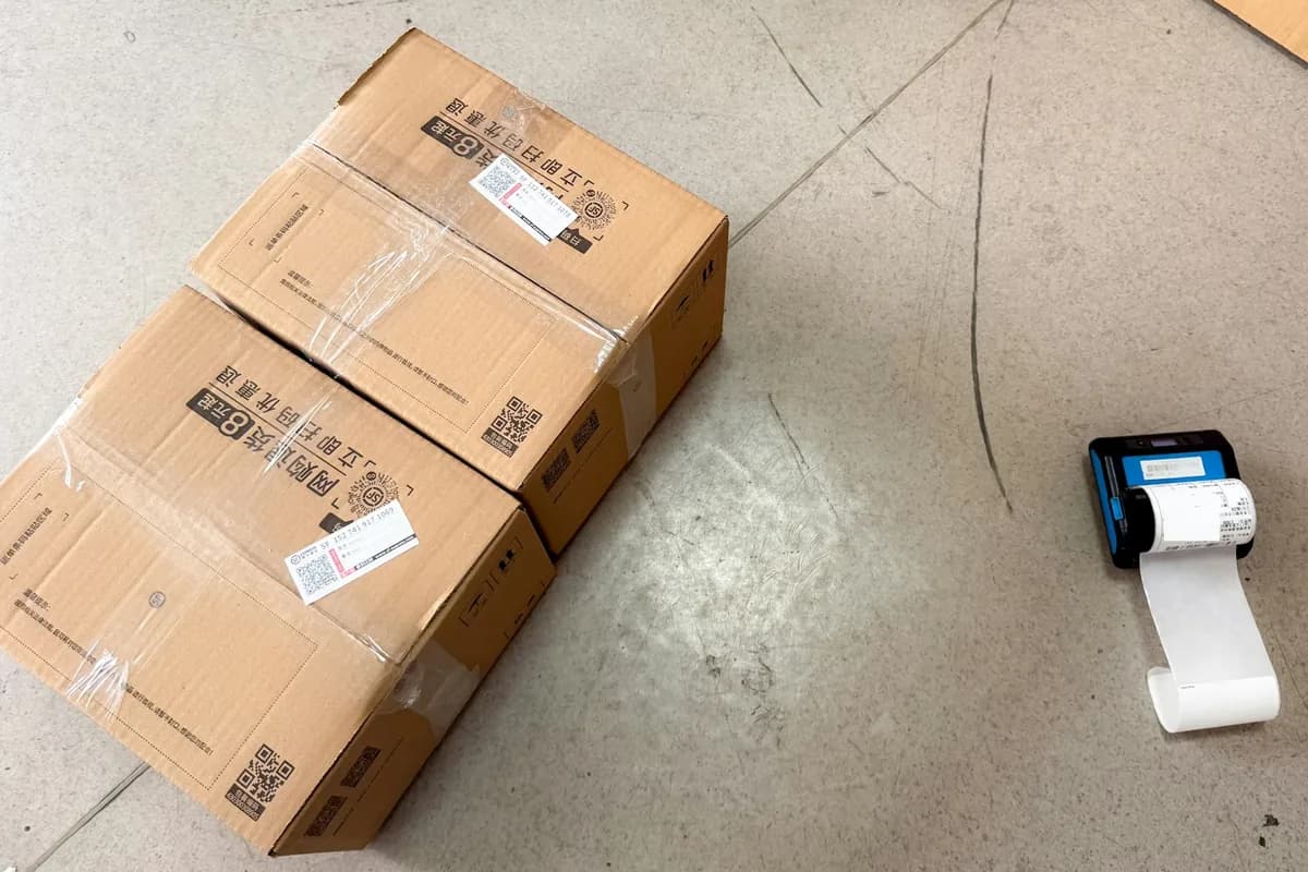Shipping boxes beside a label printer