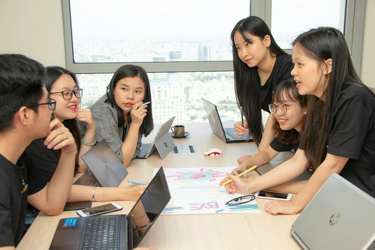Colleagues discussing a project around a table