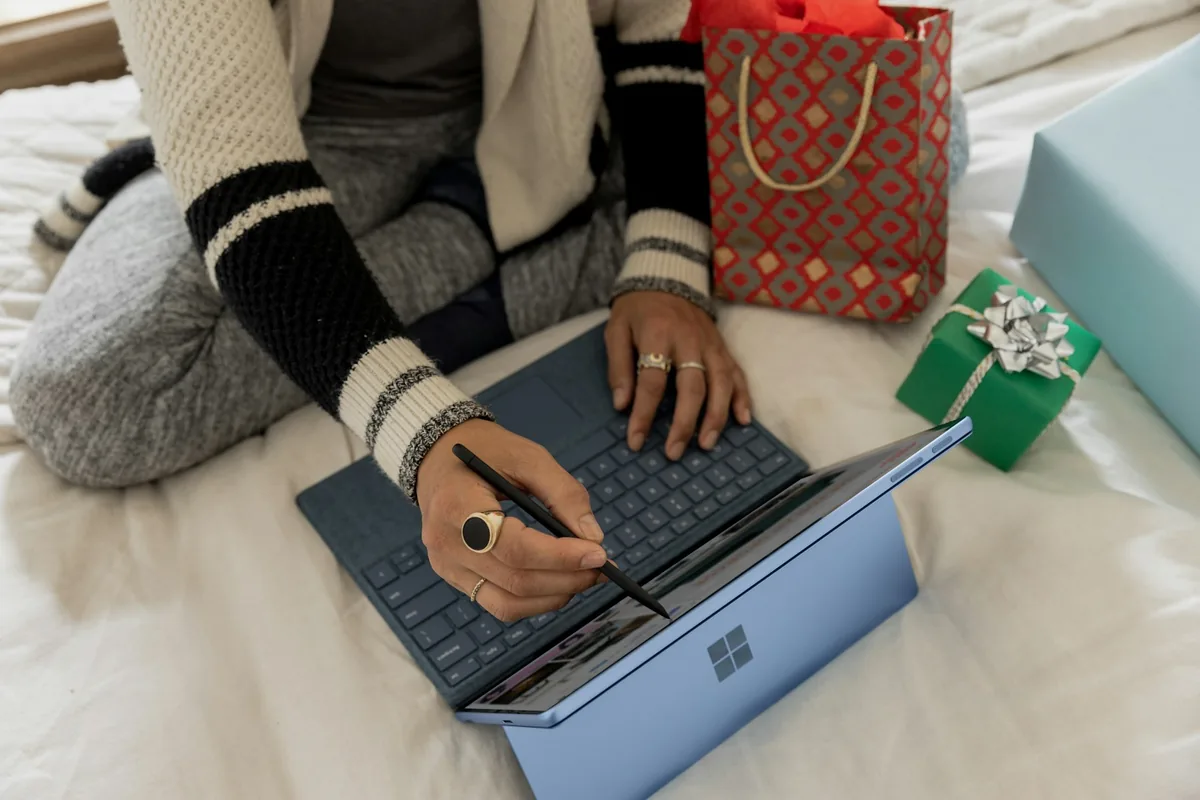 Person shopping online using a laptop