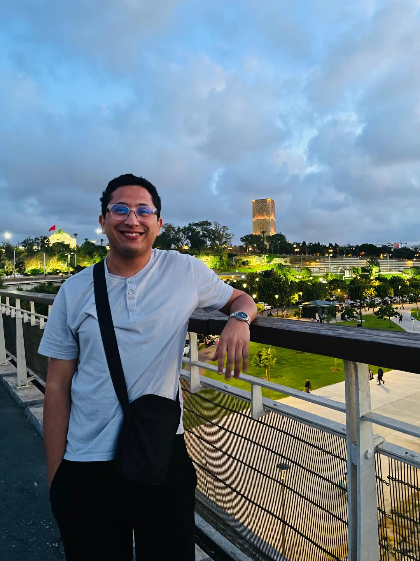 Yassine Moumen overlooking the illuminated cityscape in Rabat